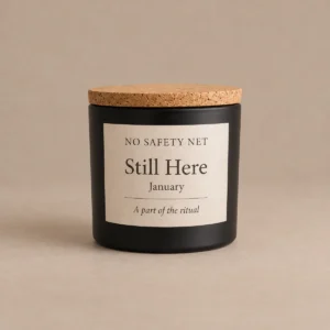 No Safety Net hand-poured candle in a black jar with cork lid